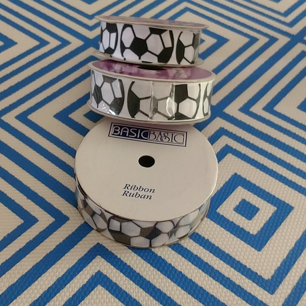 3 rolls of ribbon with soccer ball print.12+ yards